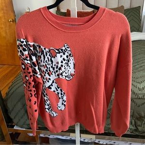 Angashion Women's orange leopard print Sweater. Size medium